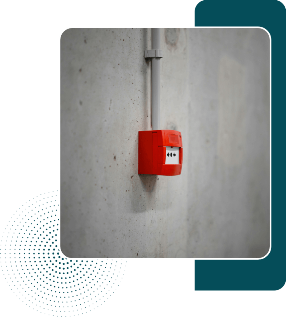 Red fire alarm on wall